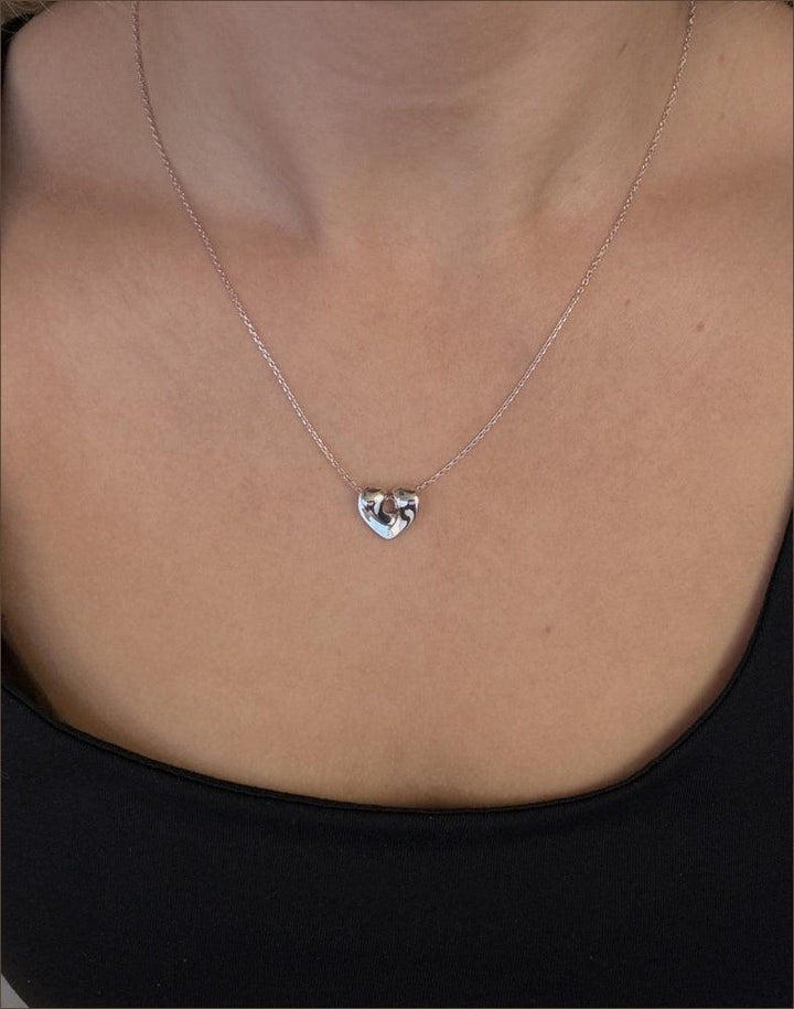 Mads Z silver Julietta 15mm heart necklace shown worn close to the neck, shiny and elegant. Model 2120124