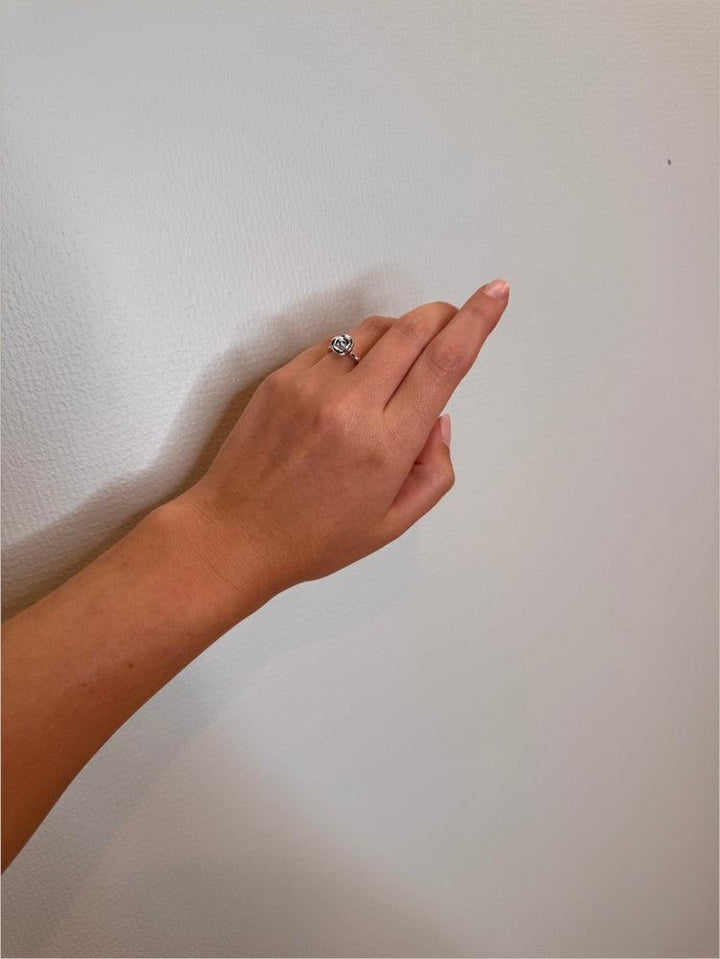 Mads Z Silver Rosalie Ring with small rose is worn on the finger, elegant silver ring in a rose design. Model 2140156-001
