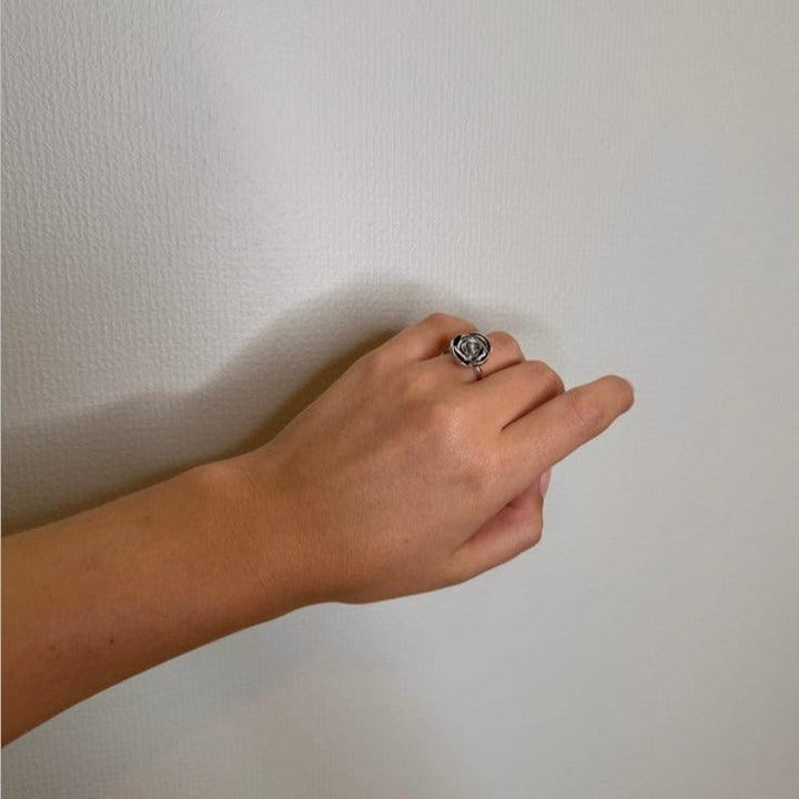 Mads Z Silver Rosalie ring with large rose can be seen on a hand, elegant in silver finish. Model 2140158-001