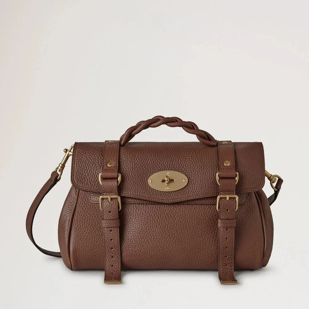 Mulberry Alexa Heavy Grain Bright Oak shows a brown leather bag with braided handle and golden details. Model HH6746/736G222.