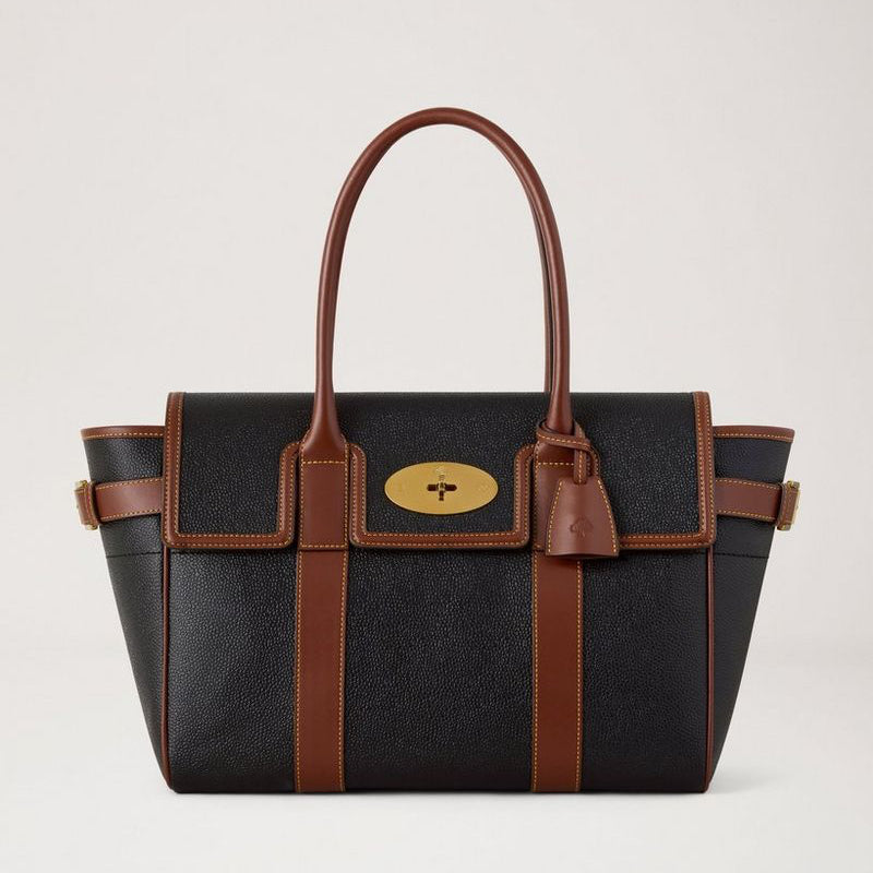 Mulberry Bayswater Black and Cognac Bio-based Scotchgrain shows a spacious black bag with brown details. Model HH0014127A340