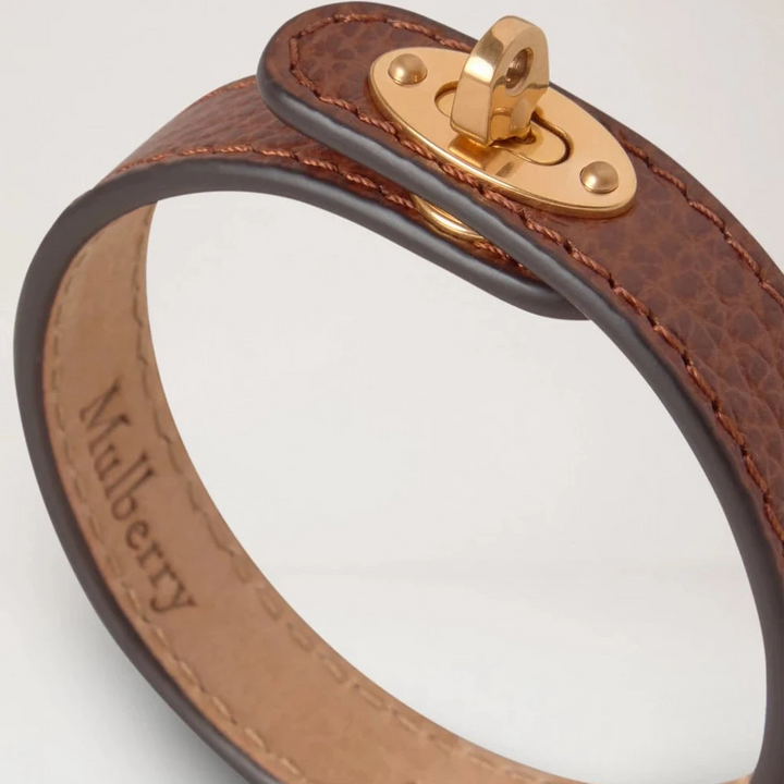 Mulberry Bayswater Thin Leather Bracelet in brown leather with golden buckle, close-up. Model QB2390205G110-001-2