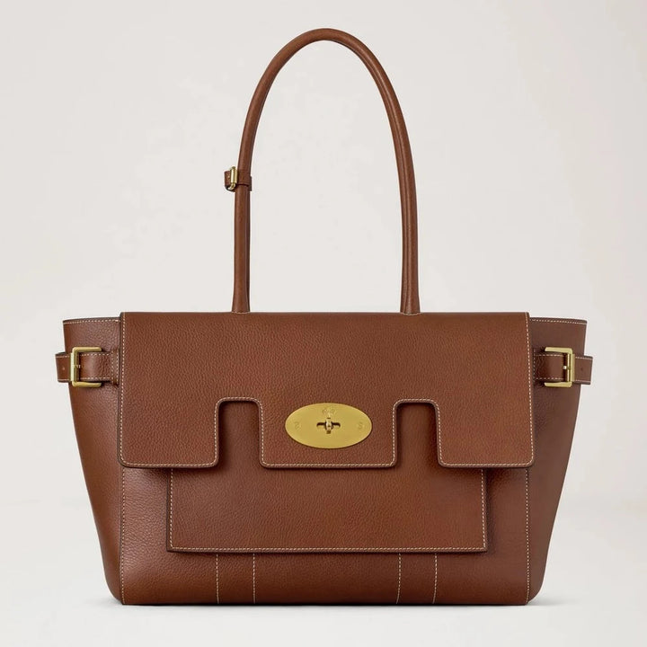Mulberry Buckle Bayswater Oak NVT shows a large brown leather bag with golden buckles and bright stitching. Model HH9964730G110