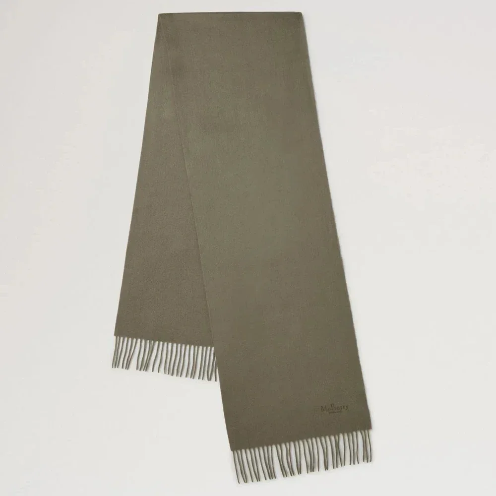 Mulberry Cashmere Scarf Olive shows an olive green cashmere scarf with fringes. Model vs4460071q140.
