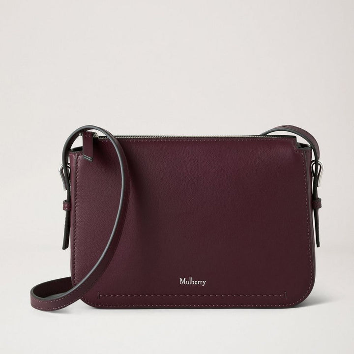 Mulberry Clovelly Pouch Black Cherry Micro Classic Grain shows an elegant dark brown leather pouch with adjustable strap. Model RL8729587K560.