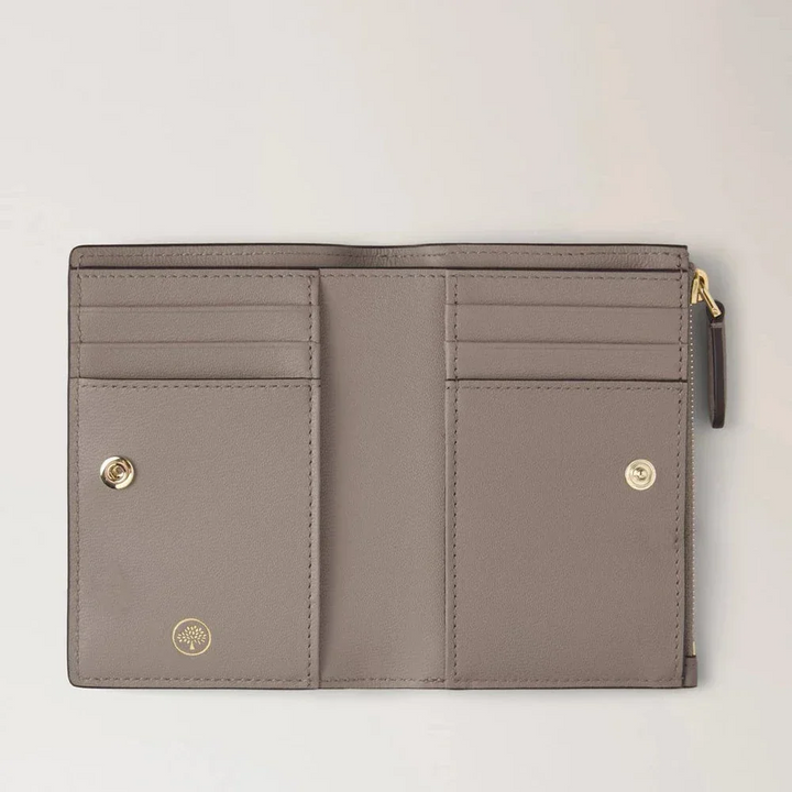 Mulberry Continental Bifold Zipped Wallet in cashmere taupe leather, open with pockets and card slots. Model RL8045205F924