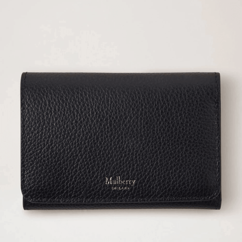 Mulberry Continental Trifold Card Holder black in black embossed leather, seen from the front in a studio environment. Model rl6824205a100