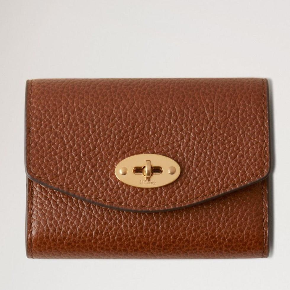 Mulberry Darley Concertina Wallet Small Classic Grain Oak, brown leather wallet with gold-colored buckle. Model RL8284552G110.