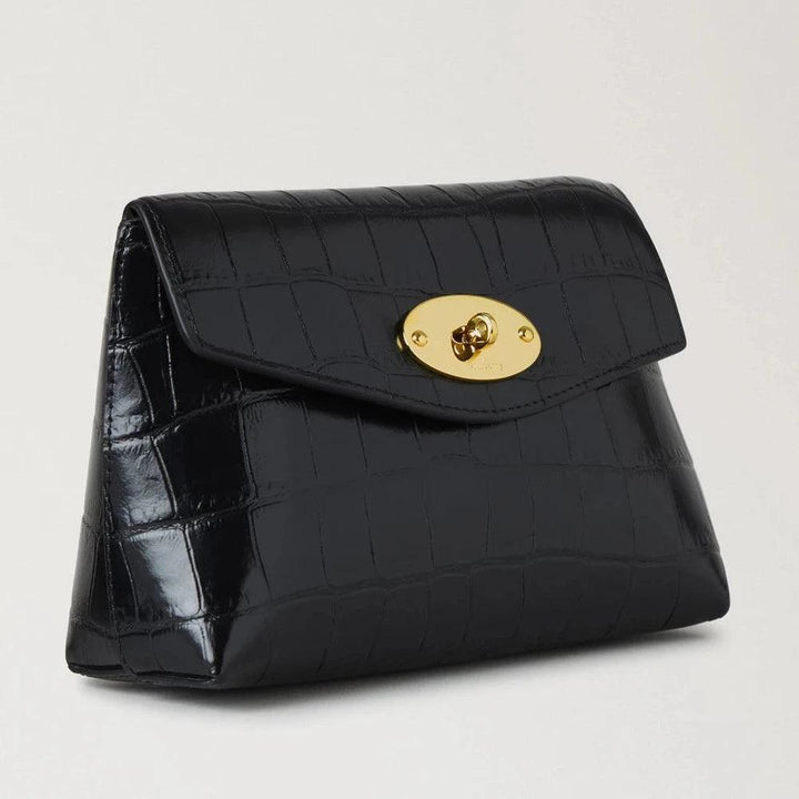 Mulberry Darley Cosmetic Pouch Black Shiny Small Croc shows a black cosmetic pouch in shiny croc leather with a gold buckle. Model RL8187641A100