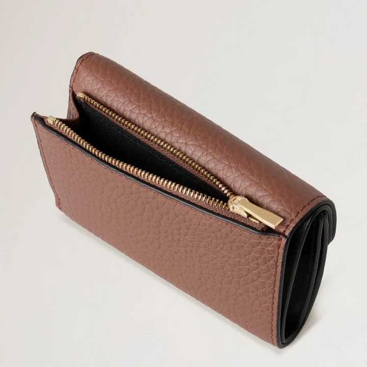 Mulberry Folded Multicard Wallet Bright Oak shows brown leather wallet with golden zipper. Model RL6660736G222