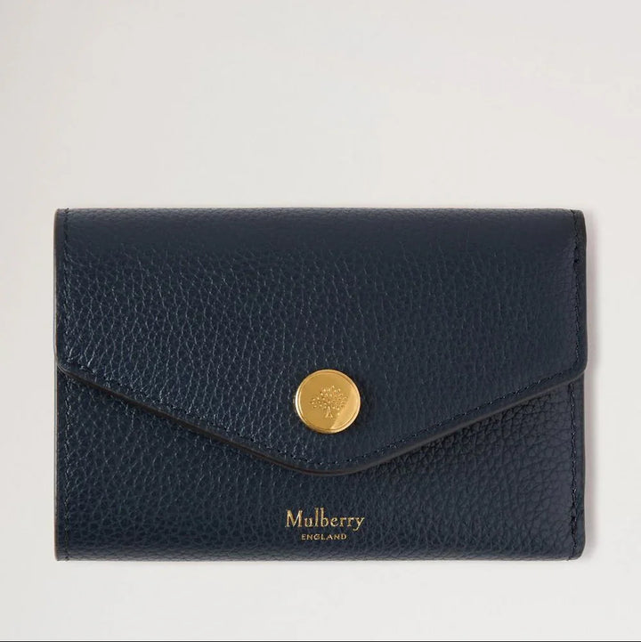 Mulberry Folded Multicard Wallet Night Sky seen from the front in dark blue leather with gold-coloured push button. Model rl6447205u888-1
