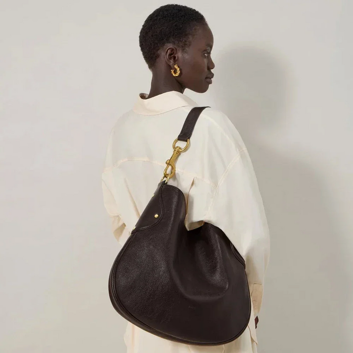 Mulberry Hackney Shoulder Bag Ebony Shiny Buffalo shown worn over the shoulder, dark brown leather bag, Model hh9963726a110