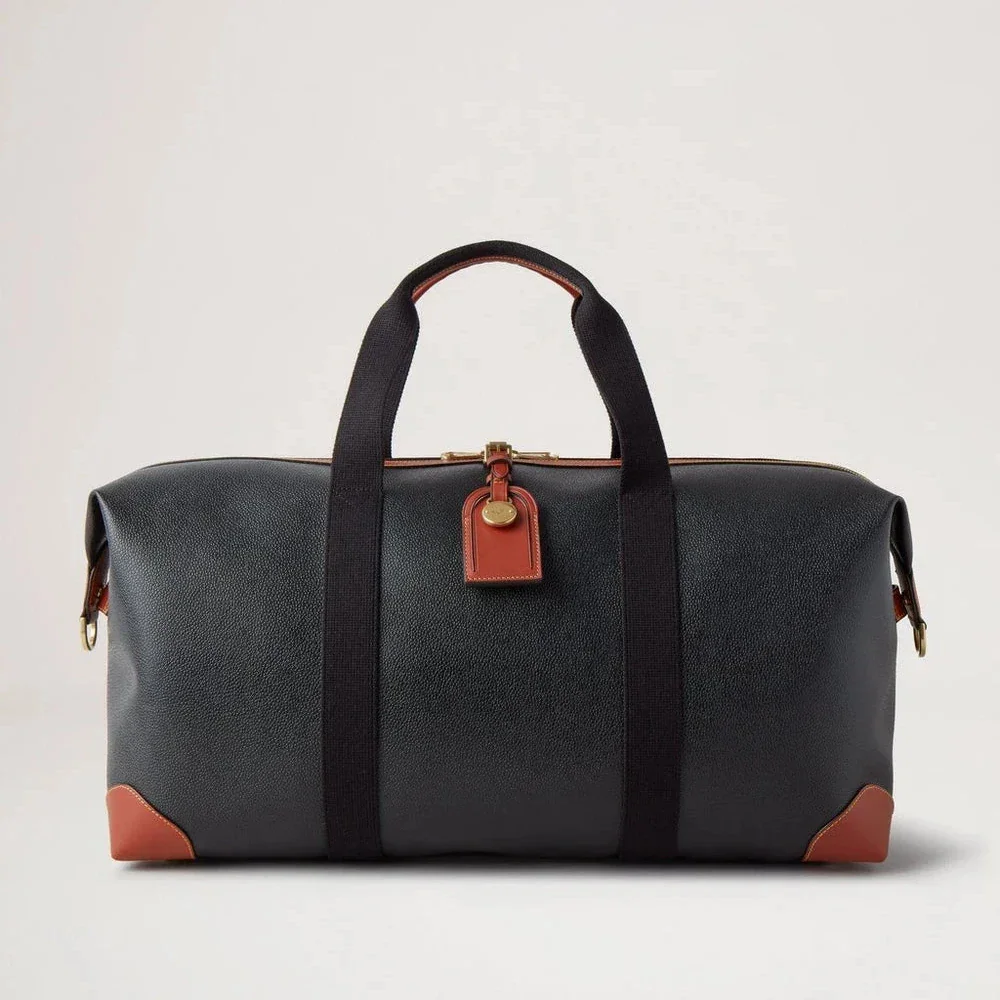 Mulberry Heritage Medium Clipper in black and cognac scotchgrain with leather details on the front. Model HL5136127A340