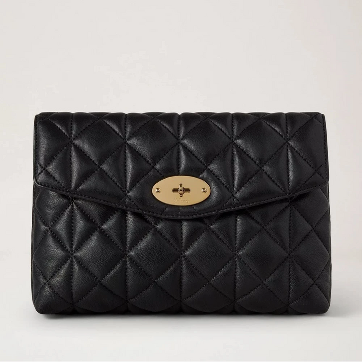Mulberry Large Darley Cosmetic Pouch shows a black quilted cosmetic pouch in leather with gold details. Model RL8897676A100
