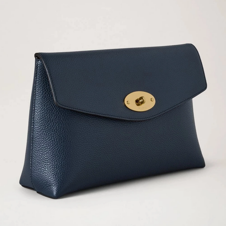 Mulberry Large Darley Cosmetic Pouch shows a dark blue cosmetic pouch in grained leather with a gold-tone clasp. Model RL5078205U888.