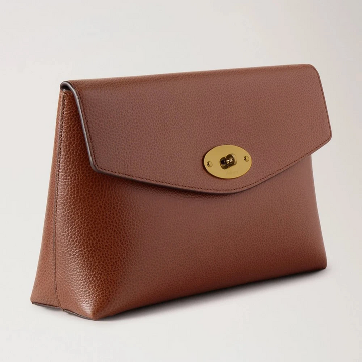 Mulberry Large Darley Cosmetic Pouch Oak Small Classic Grain shows cosmetic pouch in brown leather with gold buckle. Model RL8853552G110