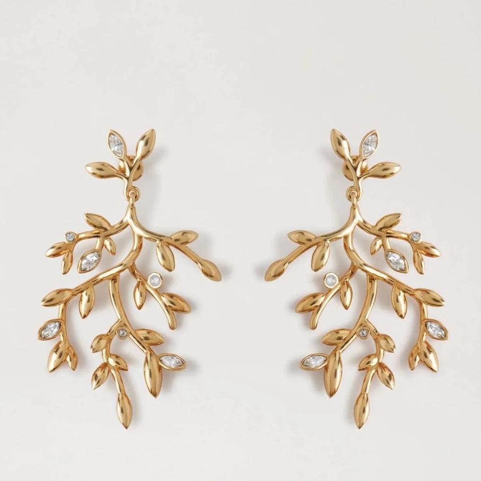 Mulberry Leaf Long Earrings in brass with leaf-shaped design and small clear stones. Model qe2401000p140.