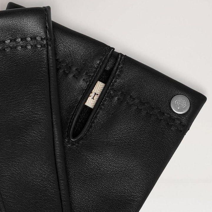 Mulberry Mens Soft Nappa Gloves black, close-up of soft black leather glove with detailed stitching. Model VG4109204A100-001