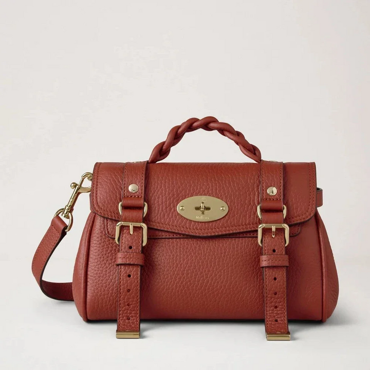 Mulberry Mini Alexa Heavy Grain Rust shows a small crossbody bag in rust red leather with braid detail, Model RL6595736L190.