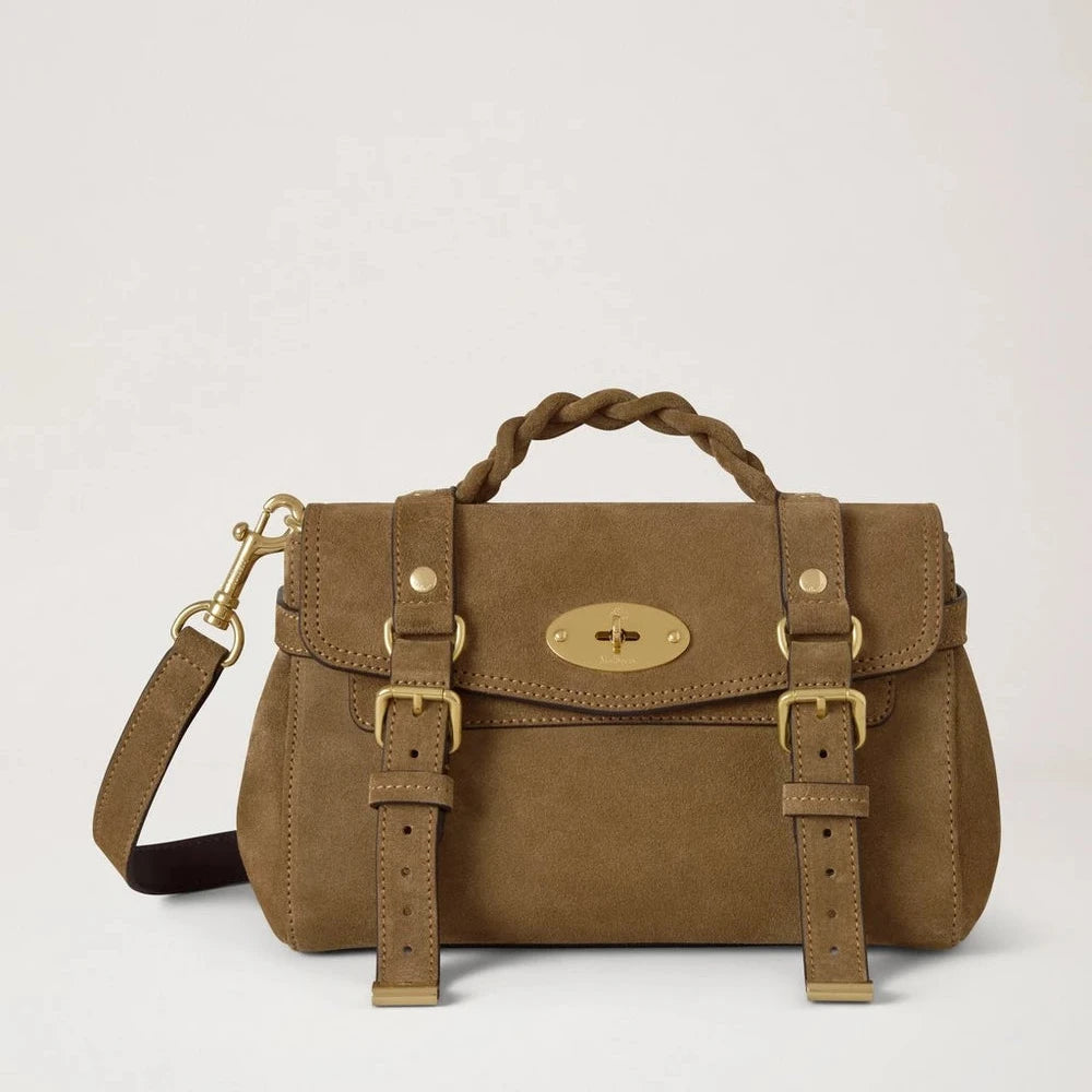 Mulberry Mini Alexa Salcombe Sand Suede showcases a light brown suede shoulder bag with braided handle, gold buckle and adjustable strap. Model RL8924731P705.
