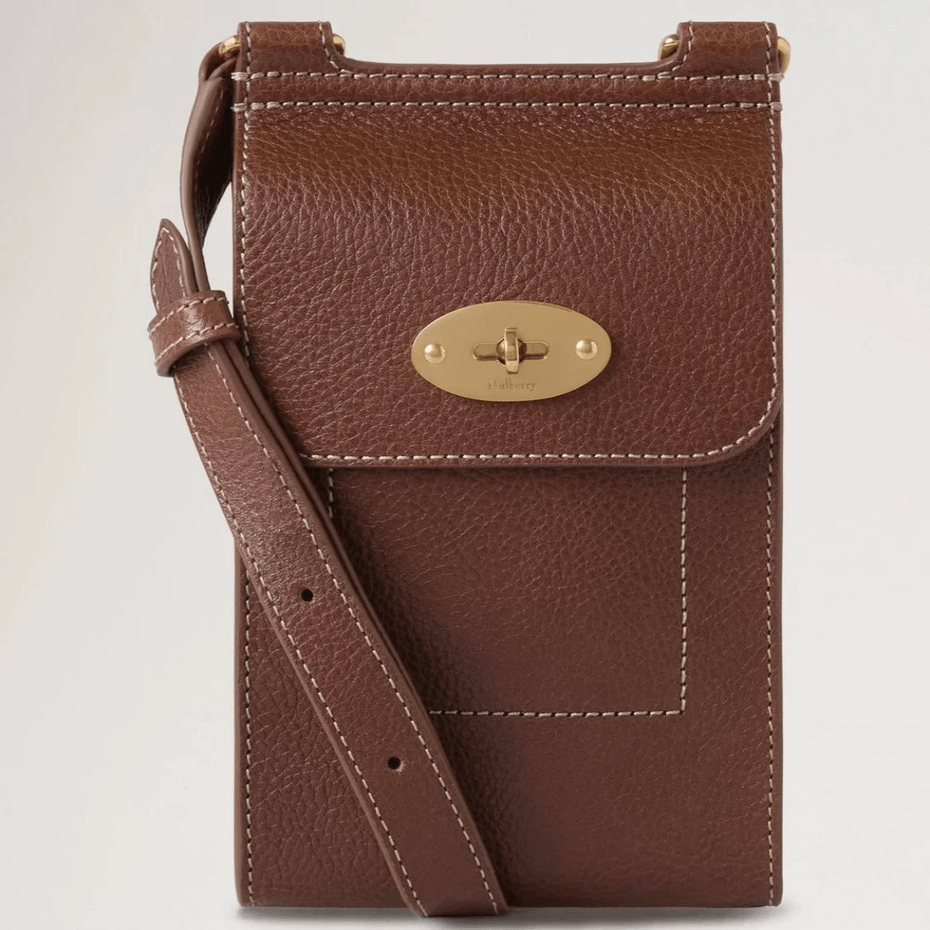 Mulberry Mini Antony Pouch in brown leather with gold-colored buckle and adjustable strap. Model RL8732181G110