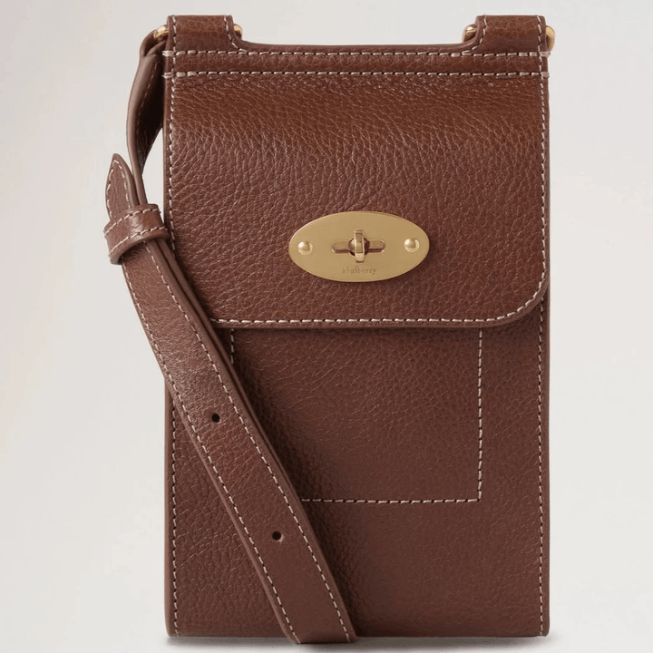 Mulberry Mini Antony Pouch in brown leather with gold-colored buckle and adjustable strap. Model RL8732181G110