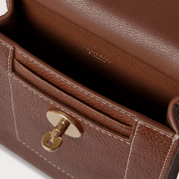 Mulberry Mini Antony Pouch in brown leather, detail of inner pocket and gold buckle.