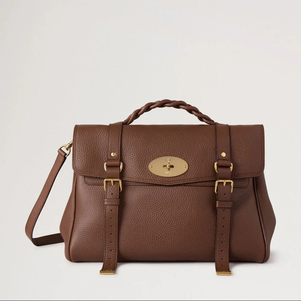 Mulberry Oversized Alexa Bright Oak Heavy Grain shows large brown leather bag with braided handle and gold-tone buckle. Model HH6884/736G222