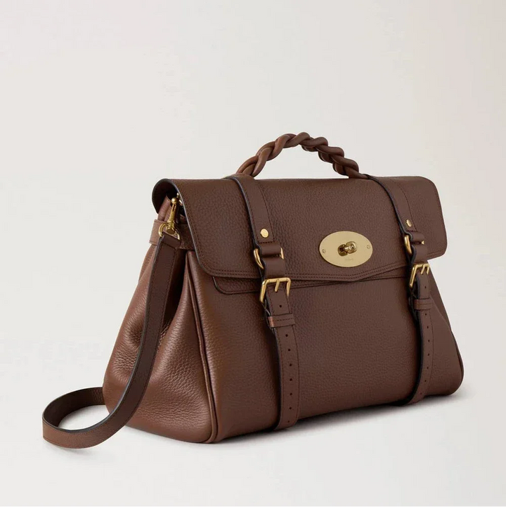Mulberry Oversized Alexa Bright Oak Heavy Grain shows a roomy brown leather bag with braided handle and gold details. Model HH6884736G222