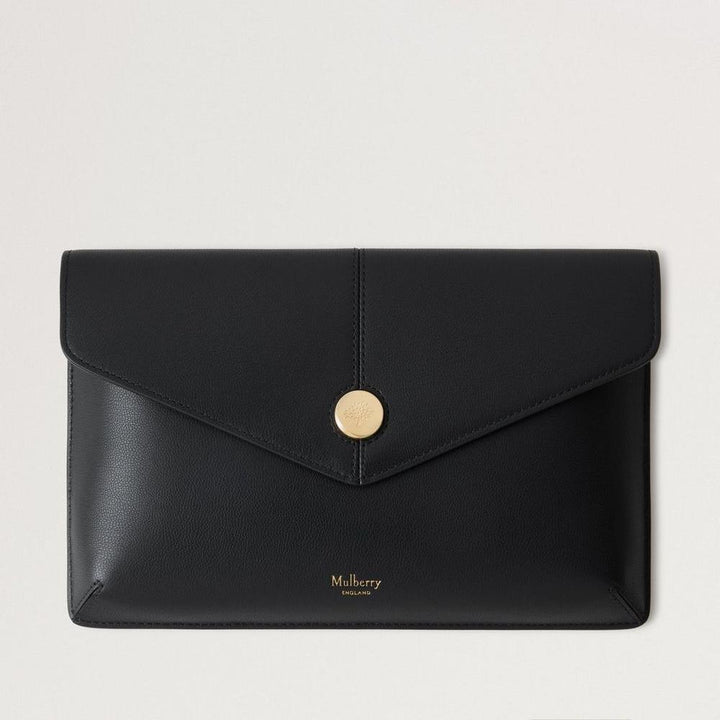 Mulberry Press Stud Envelope Pouch Black Micro Classic Grain shows a black envelope leather pouch with a gold-tone stud on the front. Model RL8707587A100.
