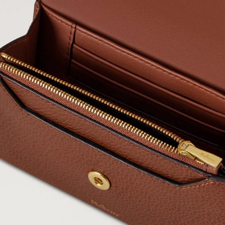 Mulberry Press Stud Wallet Oak Small Classic Grain shows close-up of brown leather wallet with golden details and card compartment, Model RL9008552G110.