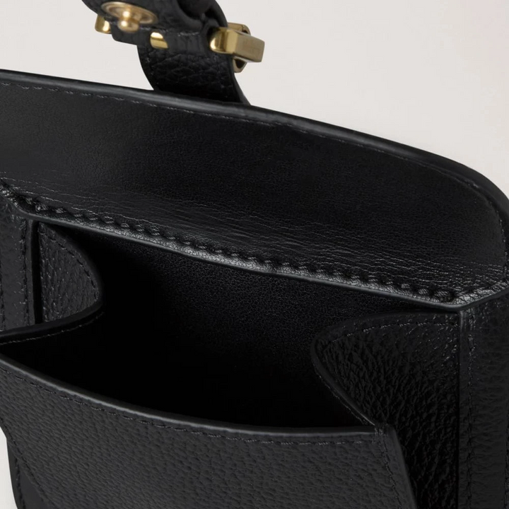 Mulberry Roxanne Wallet Black Small Classic Grain, detail of black wallet in embossed leather with golden buckle.