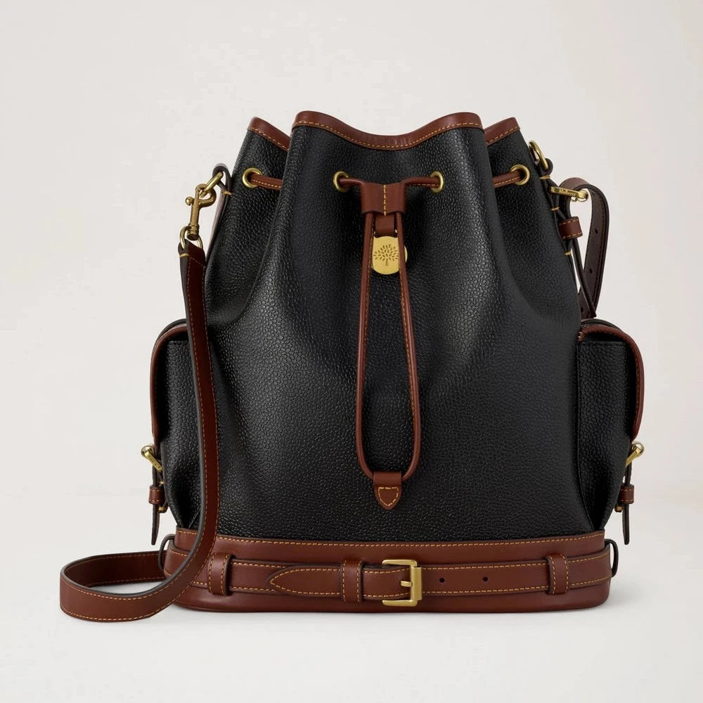 Mulberry The Scotchgrain Bucket Black and Cognac is shown here with textured black leather, cognac colored details and golden buckles. Model HH0016127A340