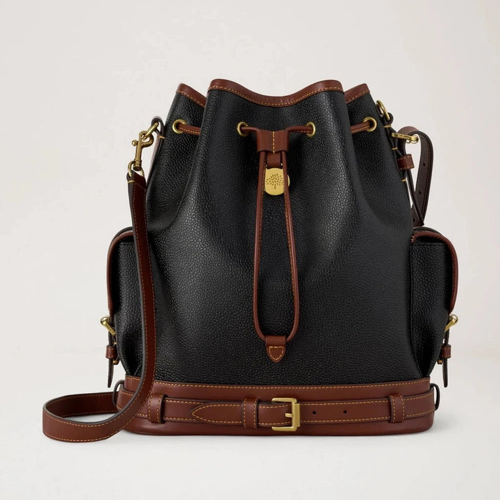 Mulberry The Scotchgrain Bucket Black and Cognac is shown here with textured black leather, cognac colored details and golden buckles. Model HH0016127A340