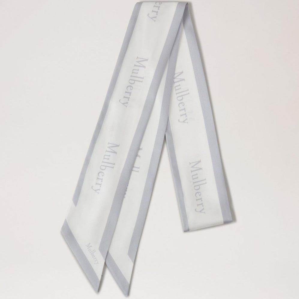 Mulberry Skinny Scarf Logo Boarder Pale Grey/White in recycled polyester, elegant narrow design. Model VS4726923Z393