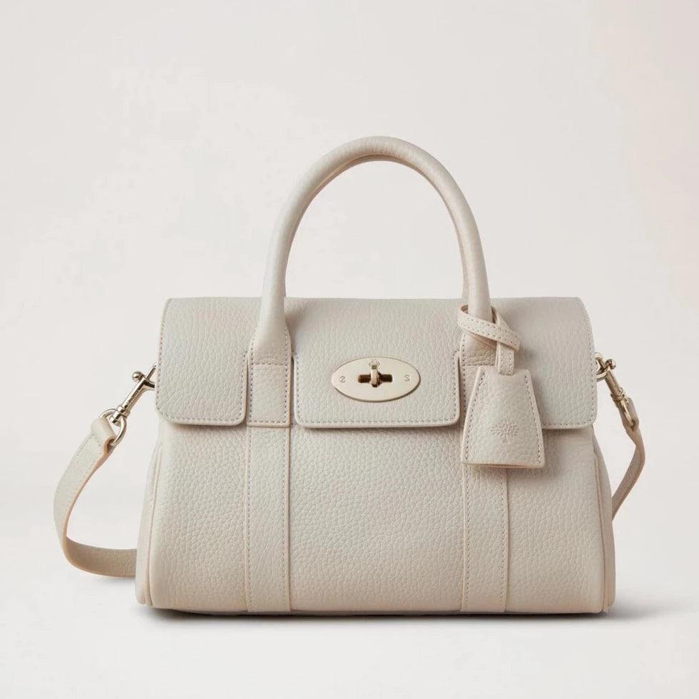 Mulberry Small Bayswater Satchel Chalk shows a smaller, elegant handbag in bright leather with a shoulder strap. Model HH9212736W160