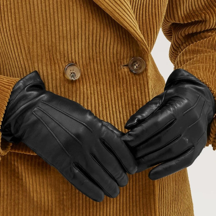 Mulberry Soft Nappa Gloves Black, classic black nappa leather gloves on models with brown jacket. Model VG4108192A100-001