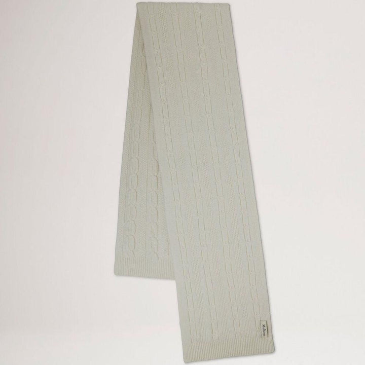 Mulberry Softie Chain Cable Knit Scarf ecru shows a long ecru colored cable knit scarf. Model VS4760969H135