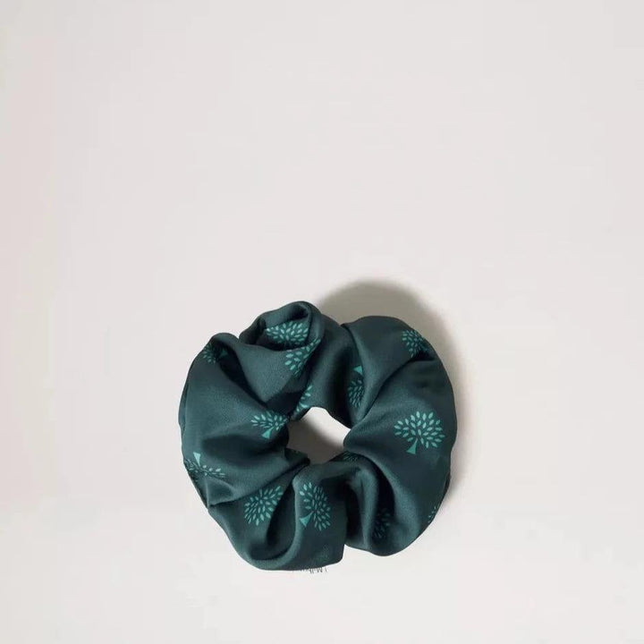 Mulberry Tree Hair Scrunchie in mulberry green with satin look and dark green wood motif. Model VA0009948Q633-1