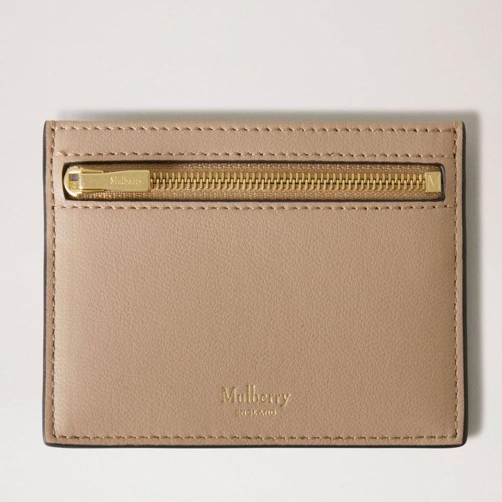 Mulberry Zipped Credit Card Slip in light leather with golden zipper, front view. Model RL7840587E631