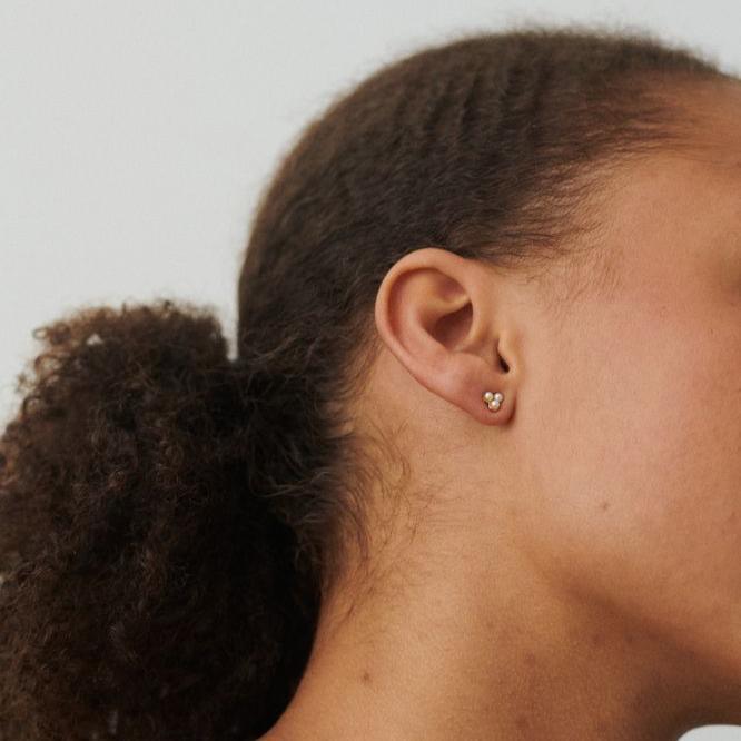 Pernille Corydon Bay silver stud earrings with freshwater pearls, shown on ear, Model E-446-S