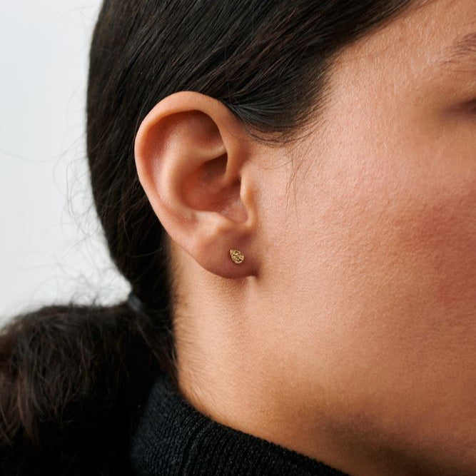 Pernille Corydon Drop Nature ear studs in gold plated appear on ear, simple and elegant style. Model E-393-GP-1