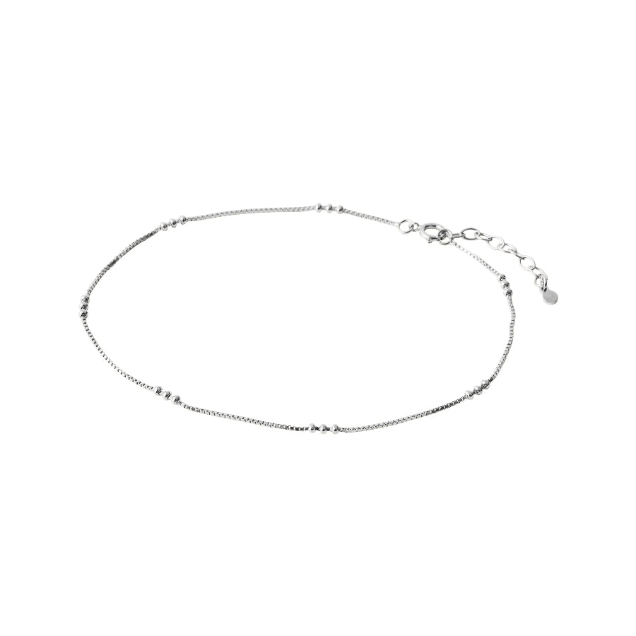 Pernille Corydon Eva Anklet Silver shows a simple, slim anklet in silver with small ball details. Model A-721-S-1