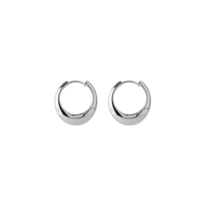 Pernille Corydon Globe Huggies in silver, stylish and shiny creoles on a white background. Model E-401-S.