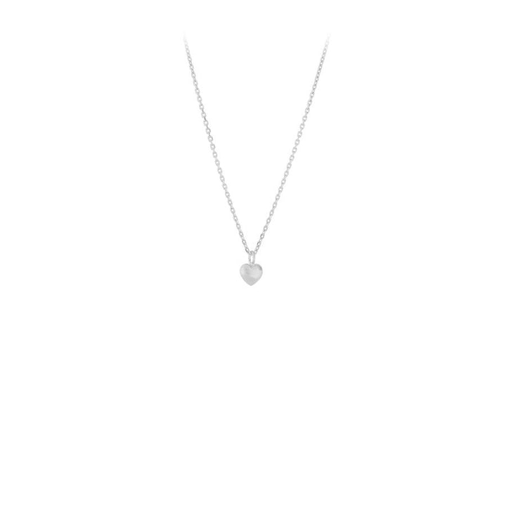 Pernille Corydon Love necklace in silver with heart pendant, elegant on white background. Model N-385-S-1