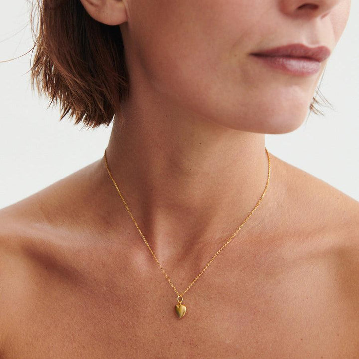 Pernille Corydon Love Pendant gold-plated heart pendant worn around the neck, golden color. Model P-962-GP-2