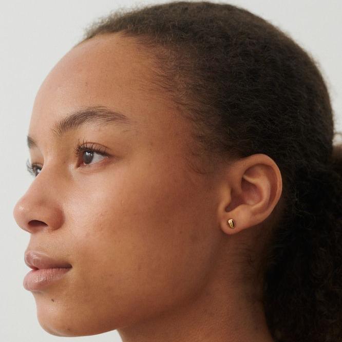 Pernille Corydon Rain gold plated stud earrings shown on model, simple and elegant design. Model E-302-GP.