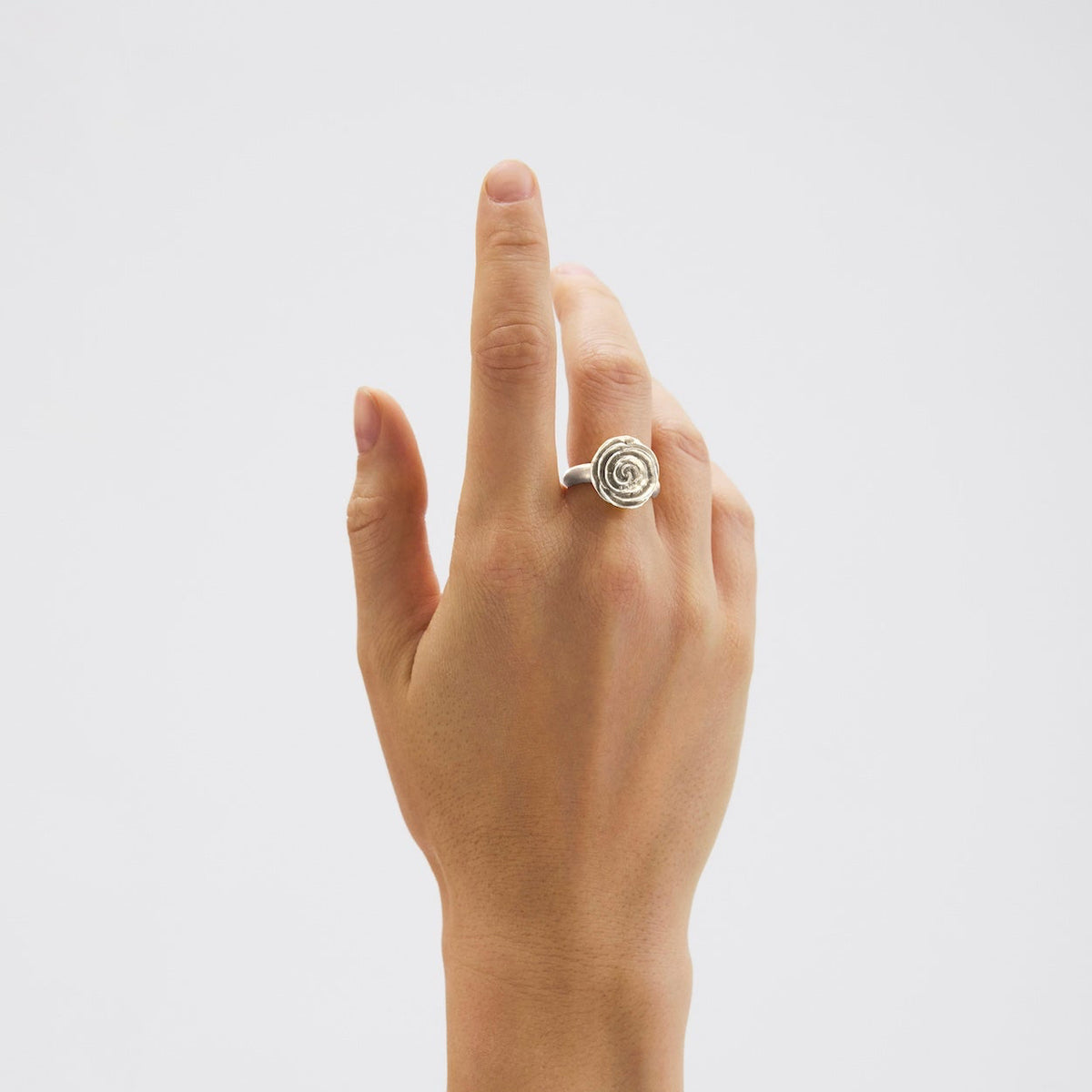 Pernille Corydon Rose ring in silver is worn on the hand, matte surface and elegant rose design. Model R-537-S-001