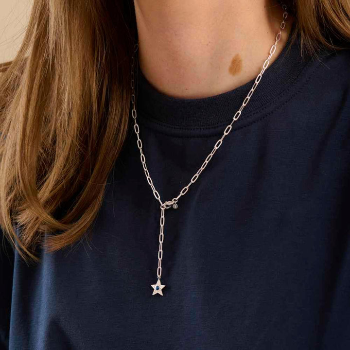 Pernille Corydon Twinkling Star necklace in silver with star pendant on woman's neck, Model N-382-S
