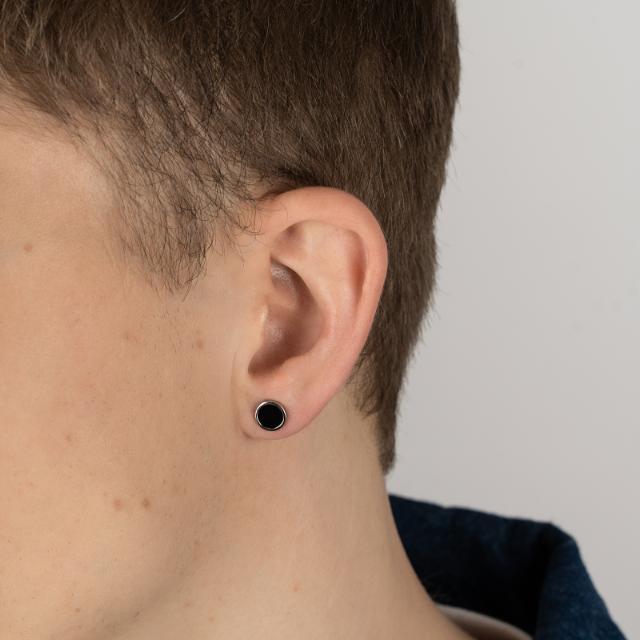 Son of Noa Orestik with onyx in silver is shown on the ear of a man. Model 30251820900